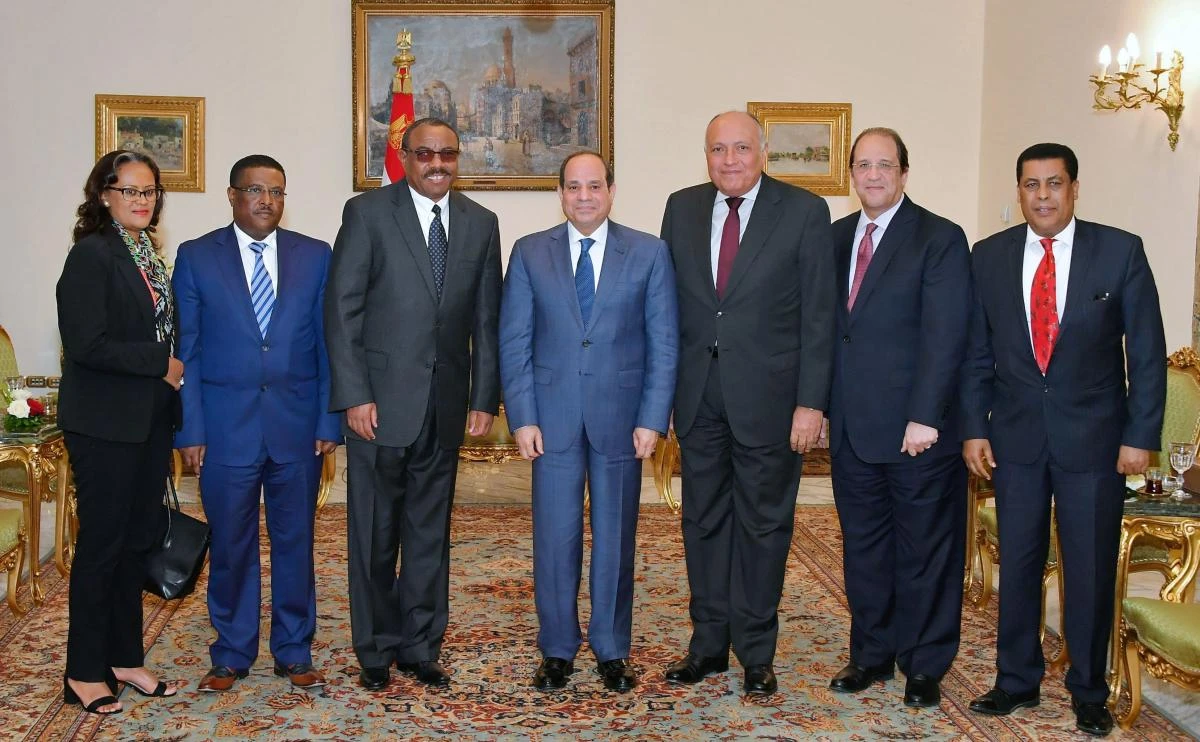 A handout picture released by the Egyptian Presidency on February 22, 2020 shows Egyptian President Abdel Fattah al-Sisi (C) meeting with Ethiopia's former prime minister and special envoy Hailemariam Desalegn (C-L) at the presidential palace in the capital Cairo, accompanied by Egyptian Foreign Minister Sameh Shoukry (C-R) and intelligence chief Abbas Kamel (2nd-R). (AFP)
