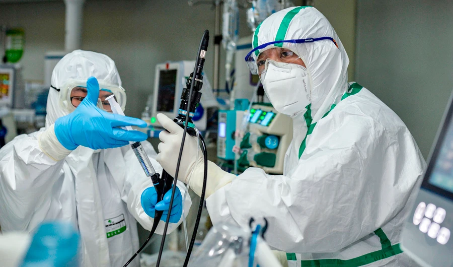 A doctor treating a patient infected by the COVID-19 coronavirus at a hospital in Wuhan in China's central Hubei province. (AFP)