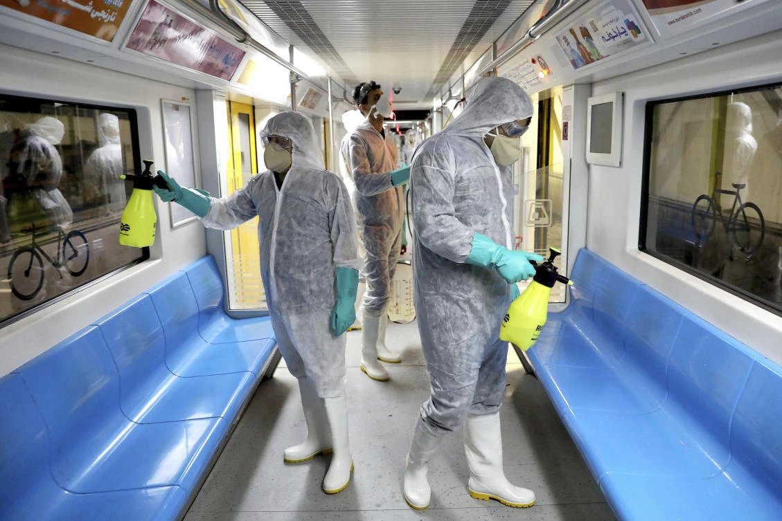 Workers disinfect subway trains against coronavirus in Tehran, Iran, in the early morning of Wednesday, Feb. 26, 2020. (AP)