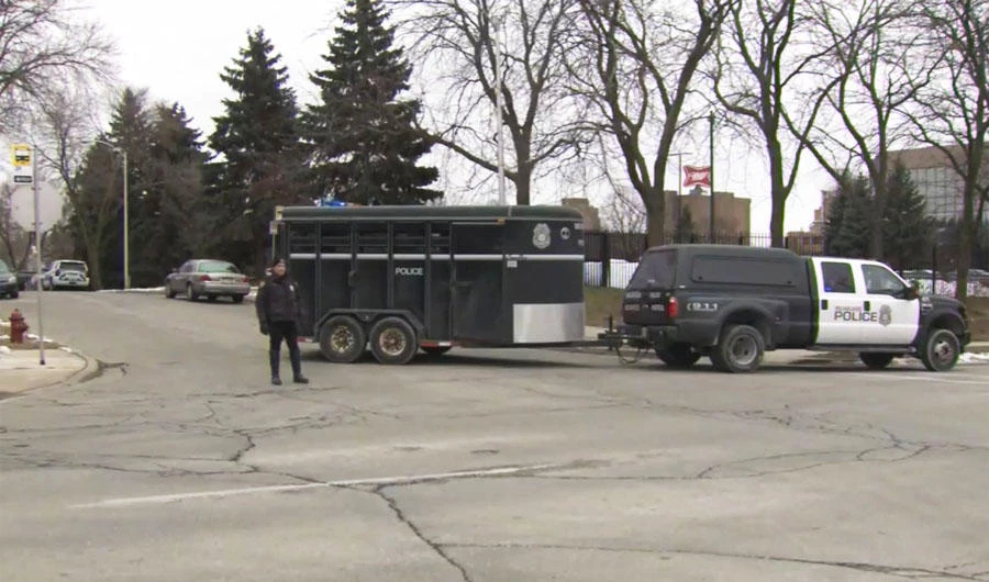 This image provided by WISN-TV, police respond to a possible shooting at the MillerCoors campus in Milwaukee on Feb. 26, 2020. (WISN-TV via AP)
