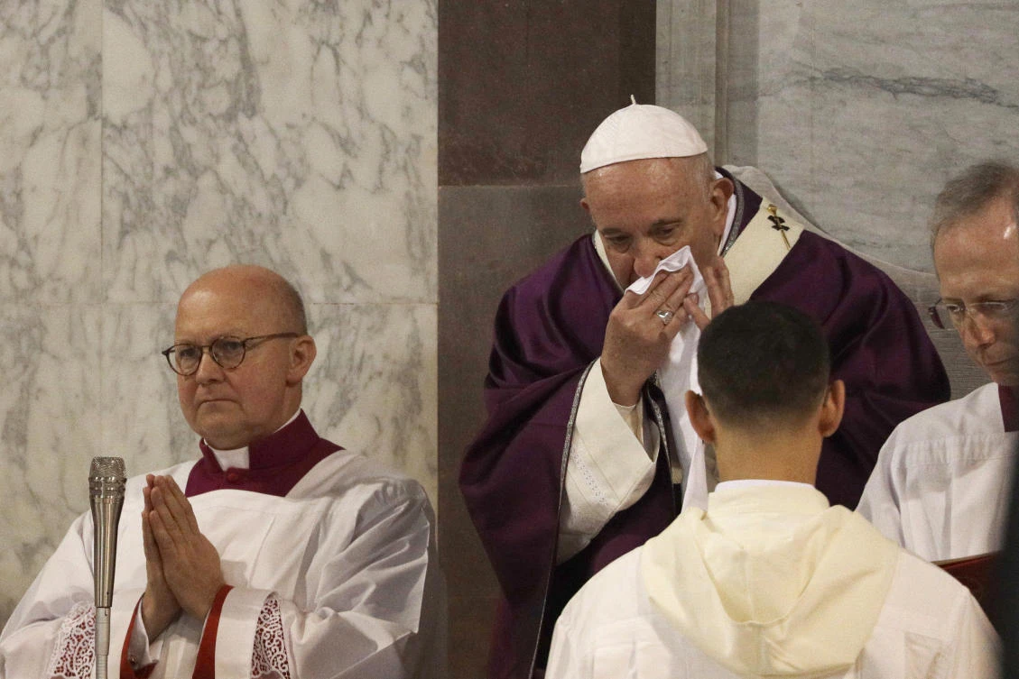 Pope Francis wipes his nose during the Ash Wednesday Mass opening Lent, the forty-day period of abstinence and deprivation for Christians before Holy Week and Easter, inside the Basilica of Santa Sabina in Rome. (AP)