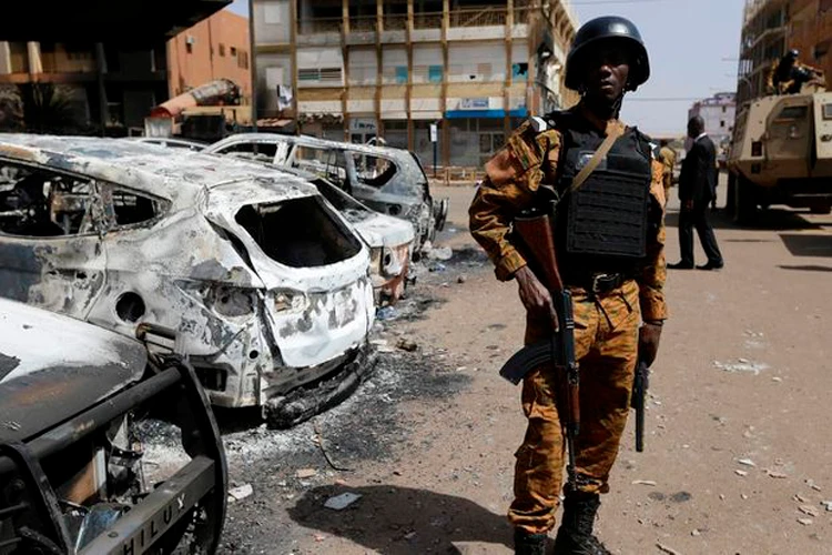 A soldier stands guard outside the Splendid Hotel in Ouagadougou, Burkina Faso, in the wake of an attack that killed 32 people, in 2016. (AP Photo)