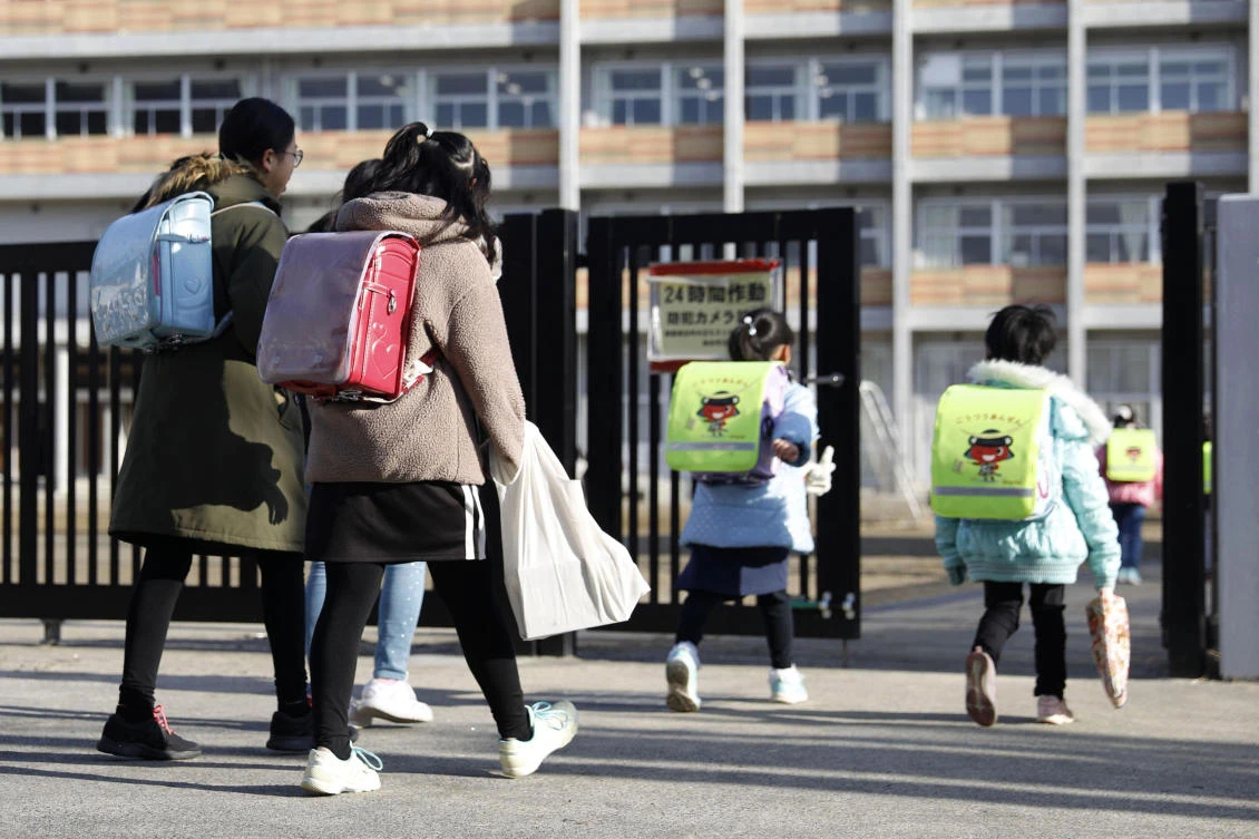 Japanese Prime Minister Shinzo Abe asked all elementary, middle and high schools nationwide on Thursday to close until late March from March 2 to help control the spread of the new virus in the country. (AP)