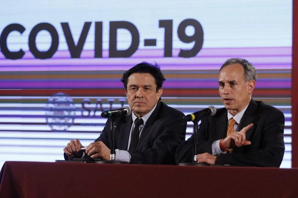 Hugo Lopez (R) and Gustavo Reyes-Teran (L) deliver a press conference about preventive measures against the novel coronavirus, COVID-19, in Mexico City. (AFP)
