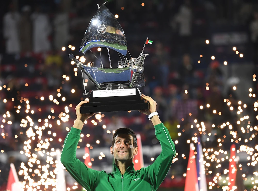 Novak Djokovic of Serbia holds the victor's trophy after winning the final of the Dubai Duty Free Tennis Championship in Dubai. (AFP)