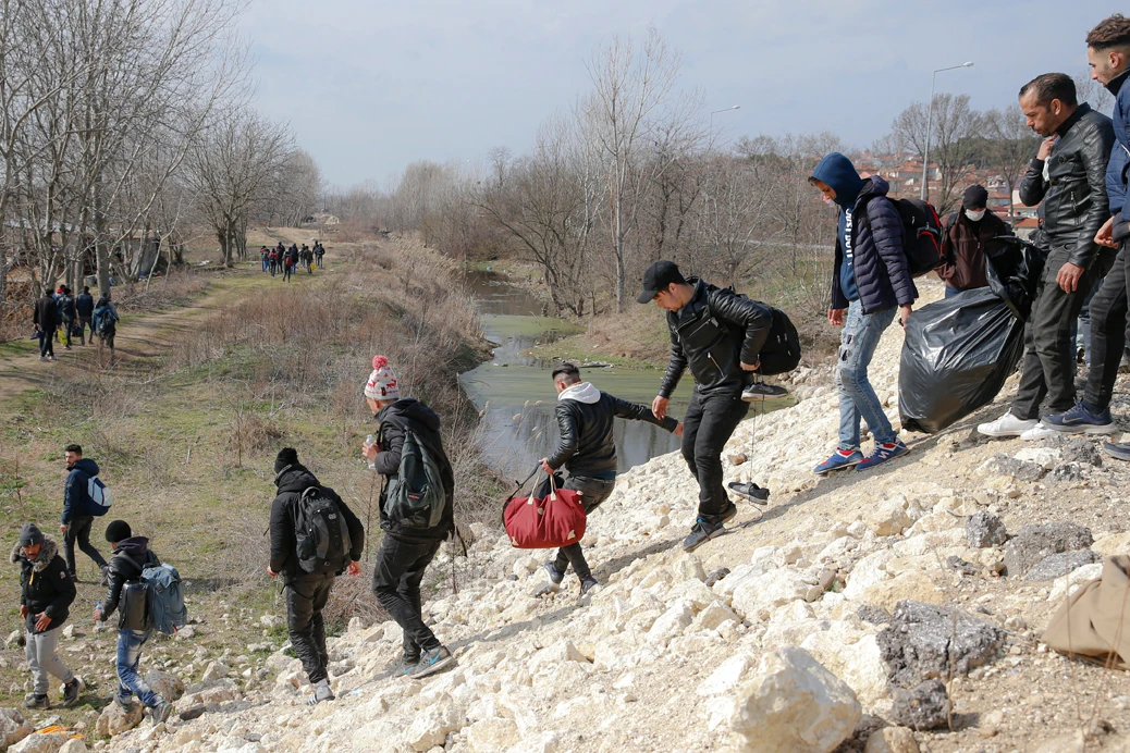 Migrants head for Greece near the Pazarakule border crossing in Edirne, Turkey, on March. 1, 2020, after Turkey opened its western borders to migrants and refugees hoping to head into the European Union. (AP Photo/Darko Bandic)