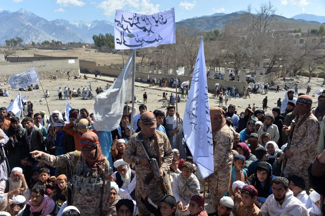Afghan Taliban militants and villagers attend a gathering in Alingar district of Laghman Province on March 2, 2020 as they celebrate the peace deal with the Americans. (AFP)