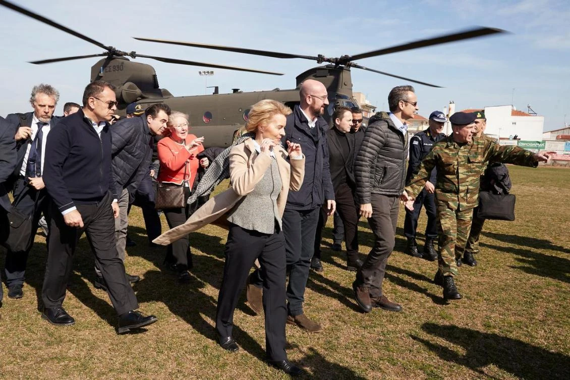 Greek PM Kyriakos Mitsotakis and European Commission President Ursula von der Leyen disembark a Chinook helicopter after flying over the Greek-Turkish border, in the region of Evros, Greece. (Reuters)