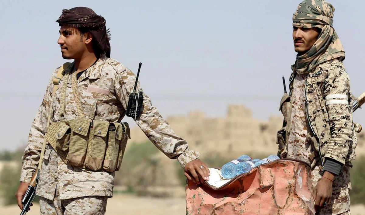 The forces of the legitimate Yemeni government in Aden pose for a picture after capturing Zinjibar. (AFP)