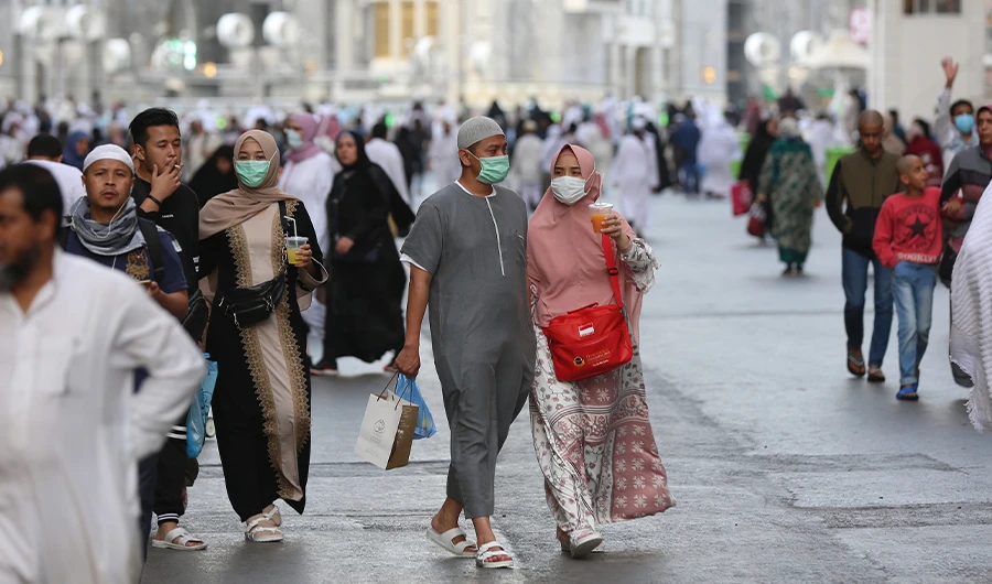Muslim pilgrims wear masks at the Grand Mosque in Saudi Arabia's holy city of Mecca on February 28, 2020. (AFP)