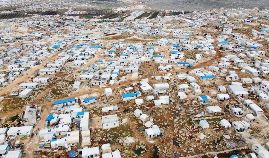 An aerial view taken on March 5, 2020 shows a camp for displaced Syrians in Deir Hassan village, in Idlib's northern countryside near the Turkish border, where the number of people seeking shelter has increased since the offensive by regime forces against the rebel-held bastions in the northwestern province. (AFP)