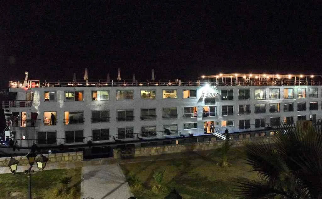 This picture taken on March 7, 2020 shows a view of a Nile cruise ship moored off the bank of the river in Egypt's southern city of Luxor, as its crew and passengers disembarked after the detection of 45 suspected COVID-19 coronavirus disease cases. (AFP)