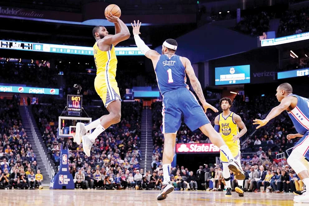Golden State Warriors forward Eric Paschall, left, shoots the ball over Philadelphia 76ers forward Mike Scott (1) during a game in San Francisco. (USA TODAY Sports)