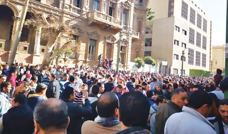 Long, and at times unruly, queues have formed outside the public health laboratories in Cairo for tests for the coronavirus. (Supplied)