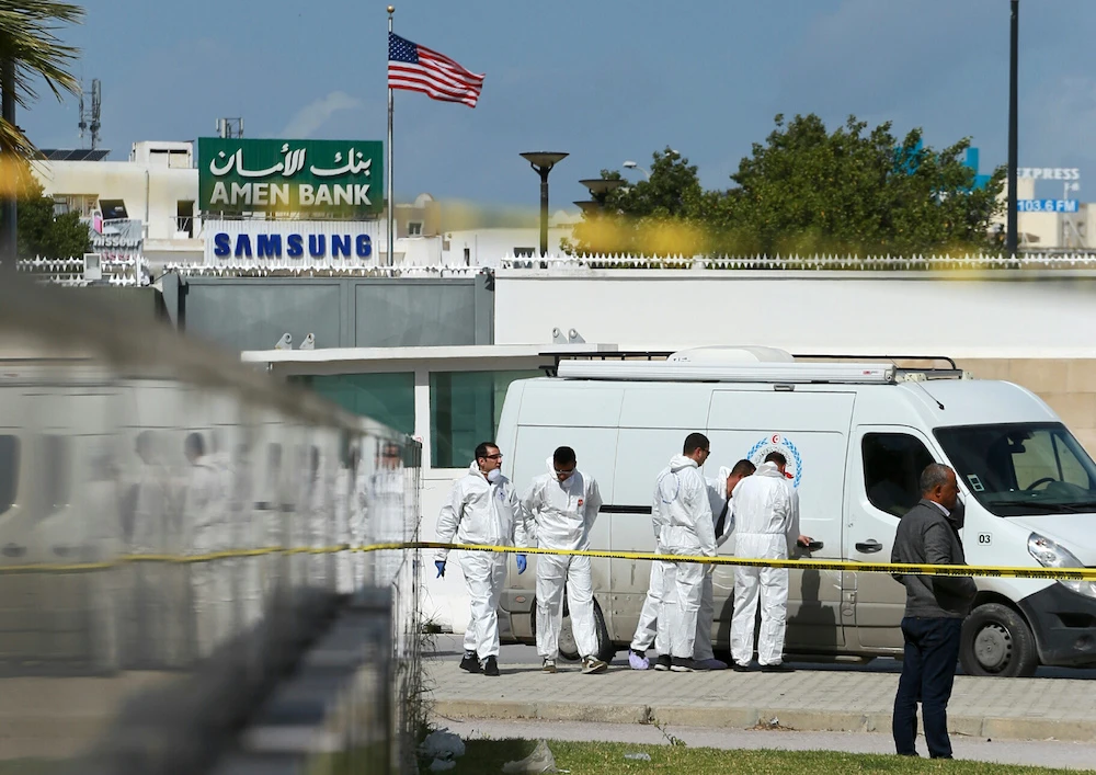 Police and forensic experts inspect the scene of an explosion near the US embassy in the Tunisian capital Tunis on March 6, 2020. (AFP)