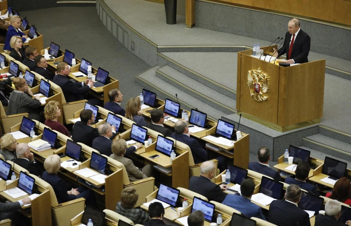 Russian President Vladimir Putin speaks during a session prior to voting for constitutional amendments at the State Duma, the Lower House of the Russian Parliament, in Moscow. (AP Photo)