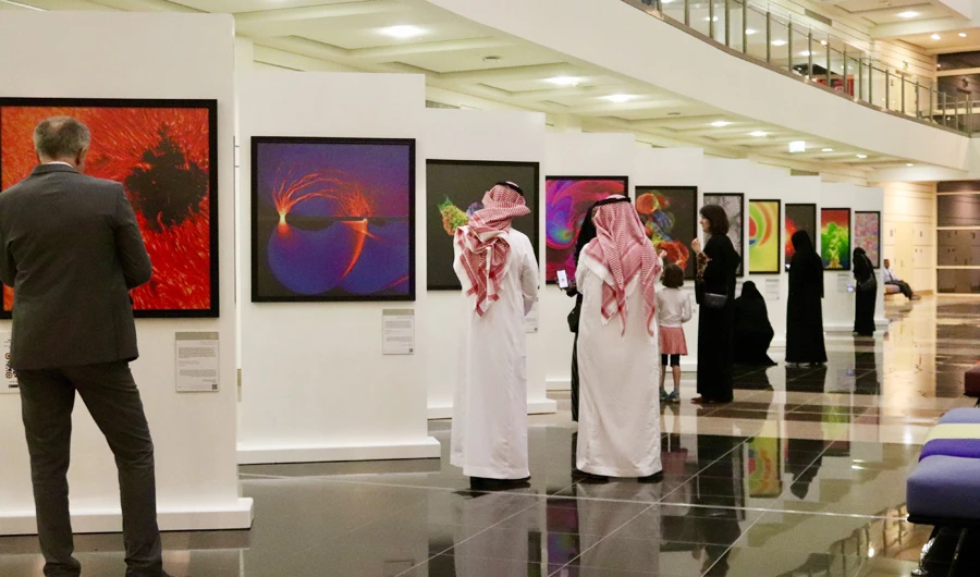 Visitors at Max Planck Images of Science exhibition at Al Faisal University. (German Embassy press officer)