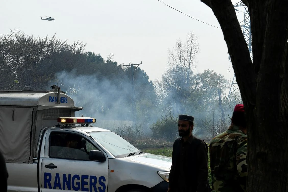 Soldiers secure an area after a Pakistani F-16 fighter crashed during a rehearsal ahead of Pakistan Day military parade in Islamabad on March 11, 2020. (AFP)