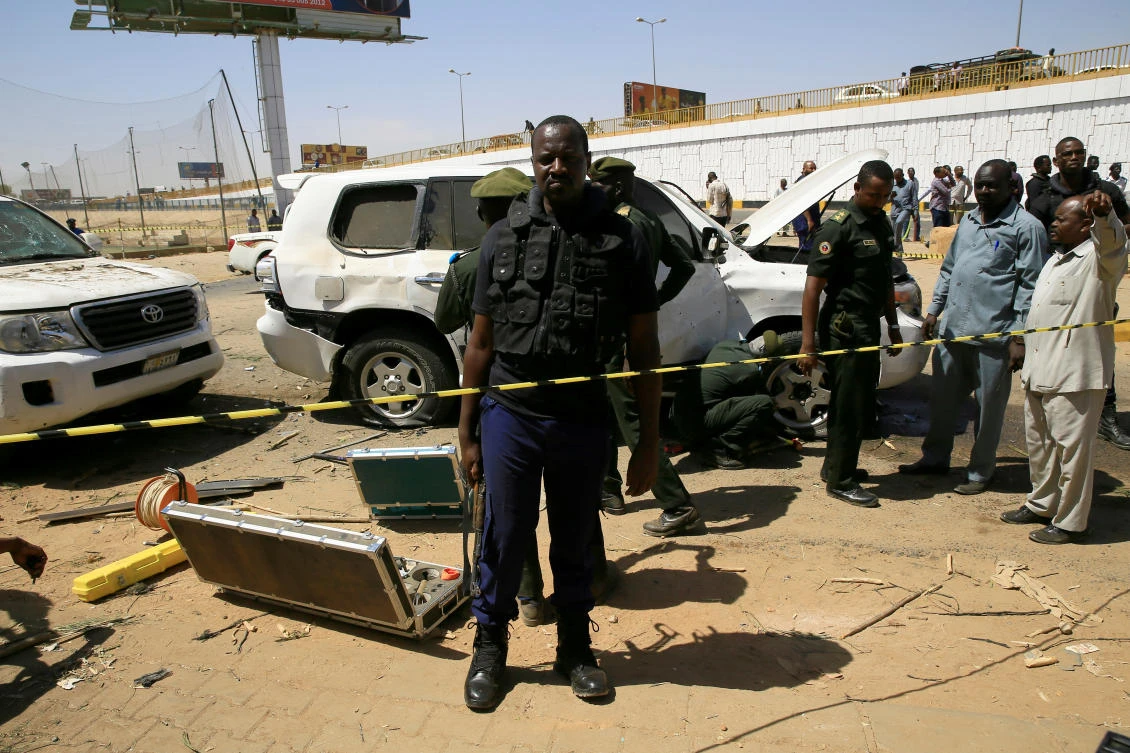 Security personnel stand near a car damaged after an explosion targeting the motorcade of Sudan's Prime Minister Abdallah Hamdok near the Kober Bridge in Khartoum, Sudan March 9, 2020. (Reuters)