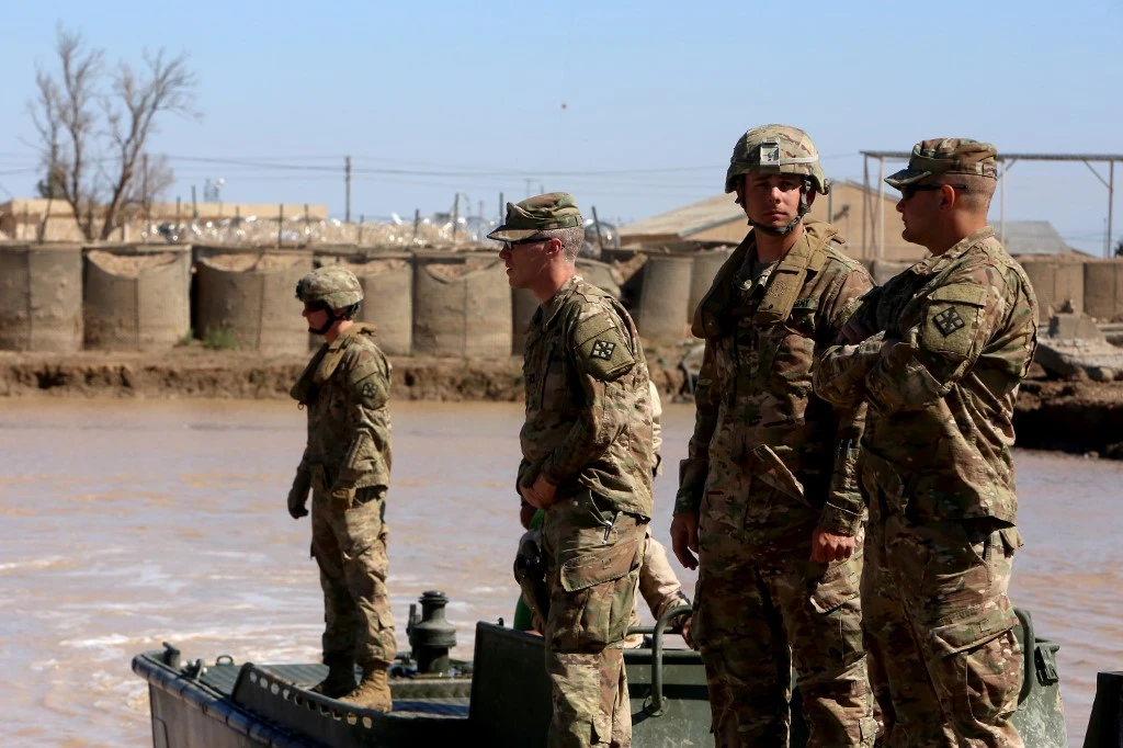 US army forces supervise during a training session at the Camp Taji base north of Baghdad. (AFP file photo)