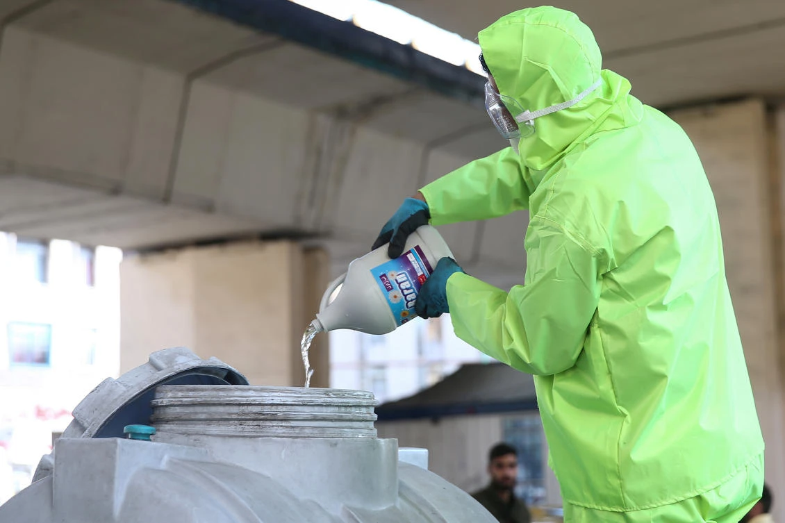 A member of a medical team wears a protective face mask, following the coronavirus outbreak, as he prepares disinfectant liquid to sanitise public places in Tehran, Iran March 05, 2020. (Reuters)