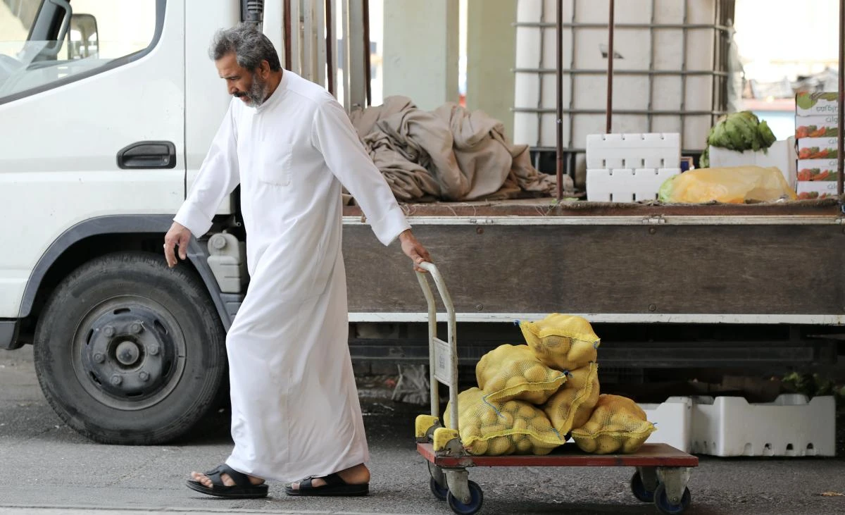 A Saudi man pulls a cart loaded with potatoes in Qatif, Saudi Arabia Mar. 9, 2020. (Reuters)