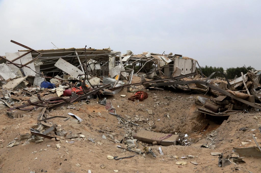 Above, destruction at a civilian airport in Kerbala in this picture taken on March 13, 2020, after the US military air strikes. (AFP)