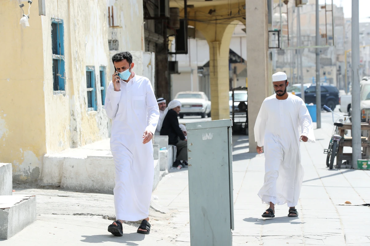 A man wears a protective face mask as he walks in Qatif, Saudi Arabia Mar. 10, 2020. (Reuters)