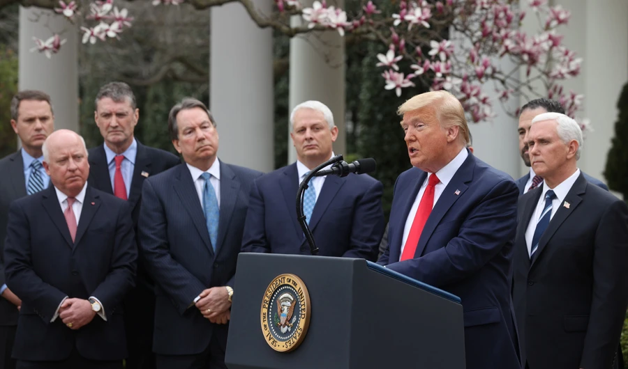 US President Donald Trump is accompanied by Vice President Mike Pence and industry executives during news conference where the president declared the coronavirus pandemic a national emergency at the White House in Washington on March 13, 2020. (REUTERS/Jonathan Ernst)