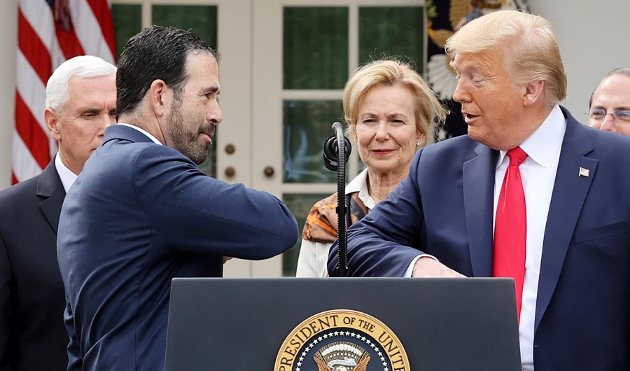 ruce Greenstein, Executive Vice President and Chief Strategy and Innovation Officer of the LHC Group offers President Donald Trump an elbow bump in place of a handshake for safety as Vice President Mike Pence and Ambassador Debbie Birx, the White House Coronavirus Response Coordinator, look on after the president declared the coronavirus pandemic a national emergency at a news conference in the Rose Garden of the White House in Washington, U.S., March 13, 2020. (REUTERS)