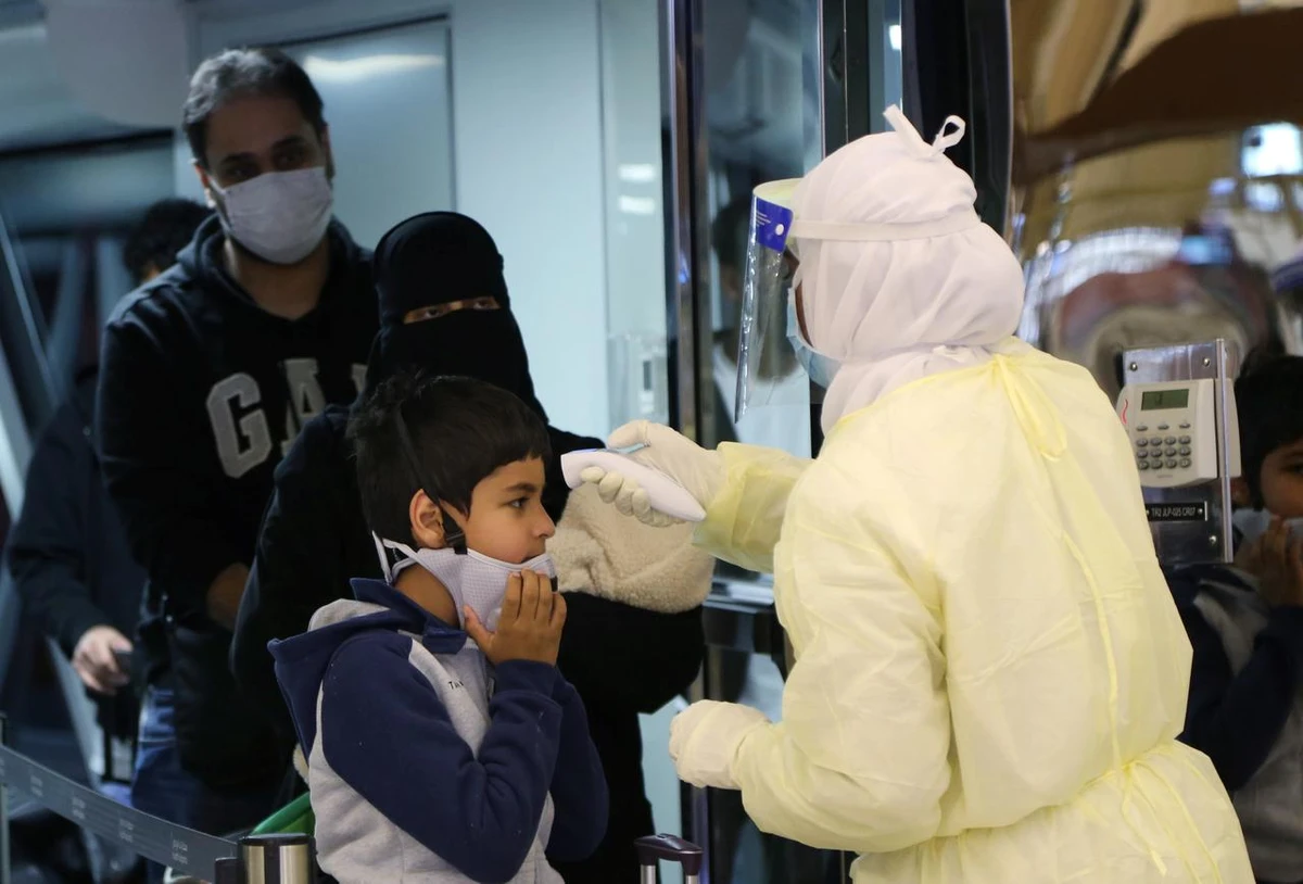 Passengers coming from China wearing masks to prevent a new coronavirus are checked by Saudi Health Ministry employees upon their arrival at King Khalid International Airport, in Riyadh, Saudi Arabia January 29, 2020. (Reuters)