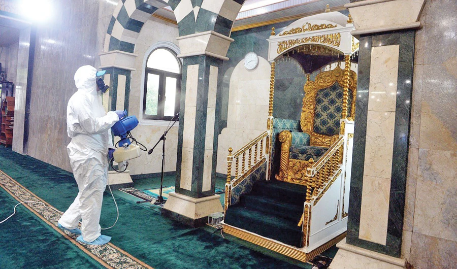 A sanitation team disinfects Al-Munawwarah Mosque in Jakarta.