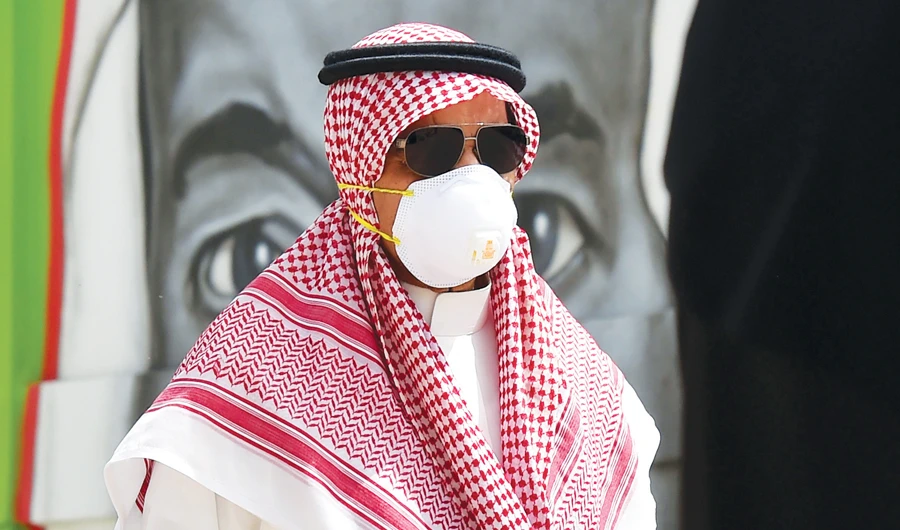 A Saudi man, wearing a mask as a precaution against coronavirus. (AFP)