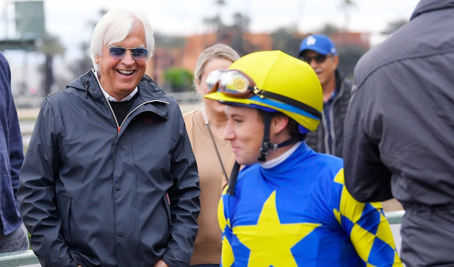 Trainer Bob Baffert, left, laughs after jockey Drayden Van Dyke dismounted Charlatan following the horse's win in the sixth race of the day at Santa Anita on Saturday, March 14, 2020, in Arcadia, Calif. (AP)