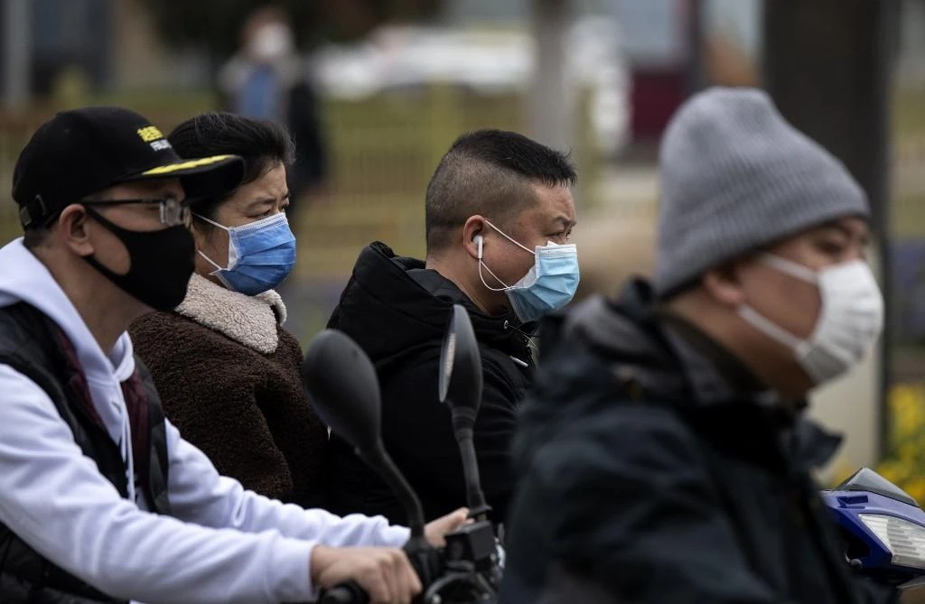 Major cities such as Beijing and Shanghai continued to wrestle with cases involving infected travelers arriving from abroad. (File/AFP)