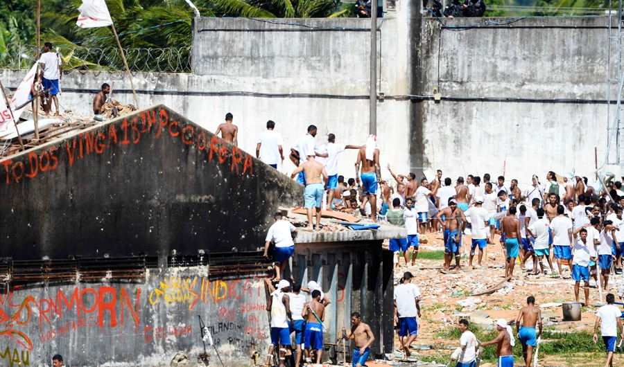 This file photo taken on January 18, 2017 shows inmates returning to the pavilions just before the special police battalion invaded the Alcacuz Penitentiary Center to regain control of the penitentiary in Rio Grande do Norte, Brazil. (AFP)