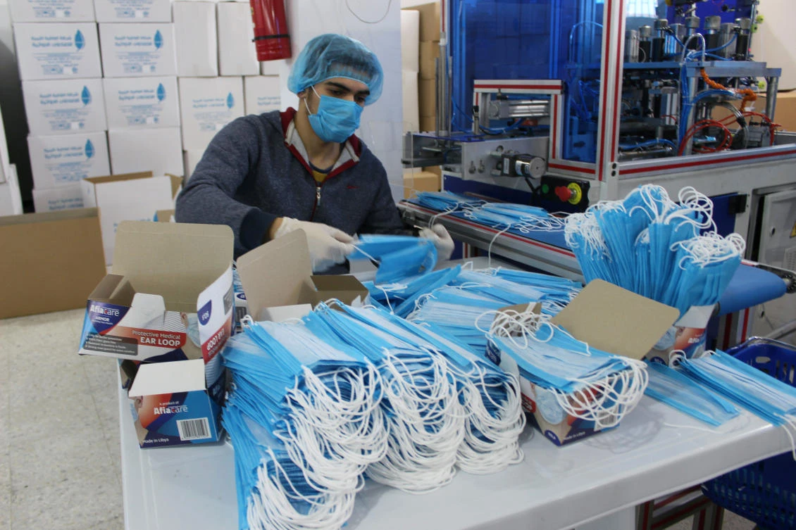 A worker wears a protective face mask and gloves at a factory for masks, as part of precautionary measures against coronavirus, in Misrata, Libya. (Reuters)