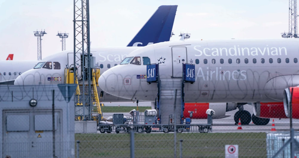 Scandinavian Airlines (SAS) Airbus A320 planes are parked at Copenhagen airport in Kastrup, Denmark, on Sunday. (Reuters)
