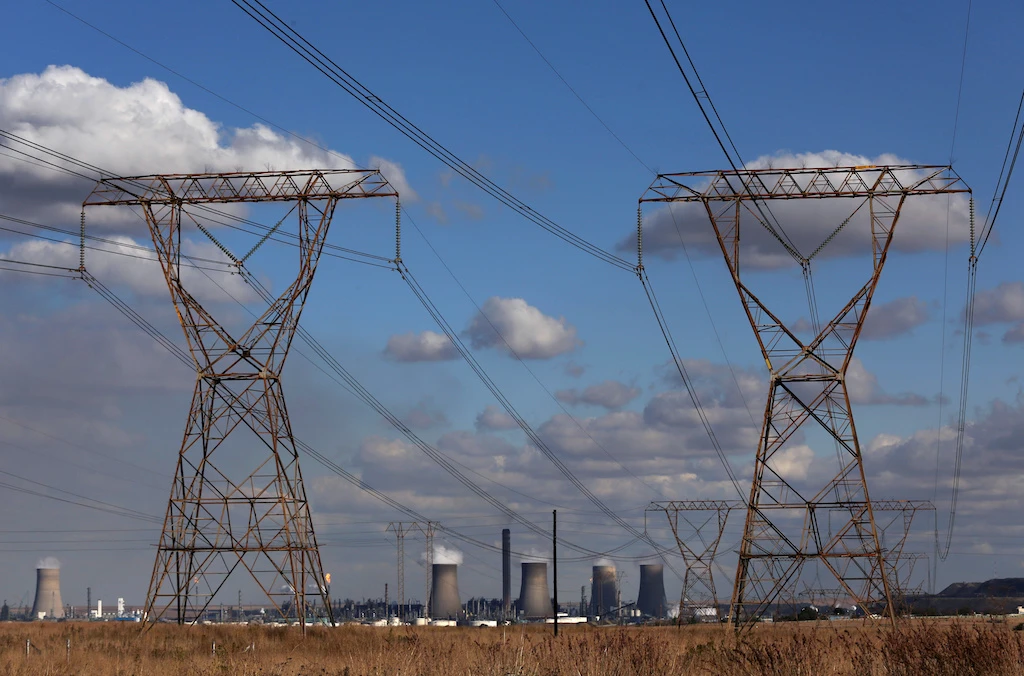 Electricity pylons are seen near cooling towers of South African petrochemical company Sasol's synthetic fuel plant in Secunda, north of Johannesburg, South Africa, May 20, 2018. (Reuters)