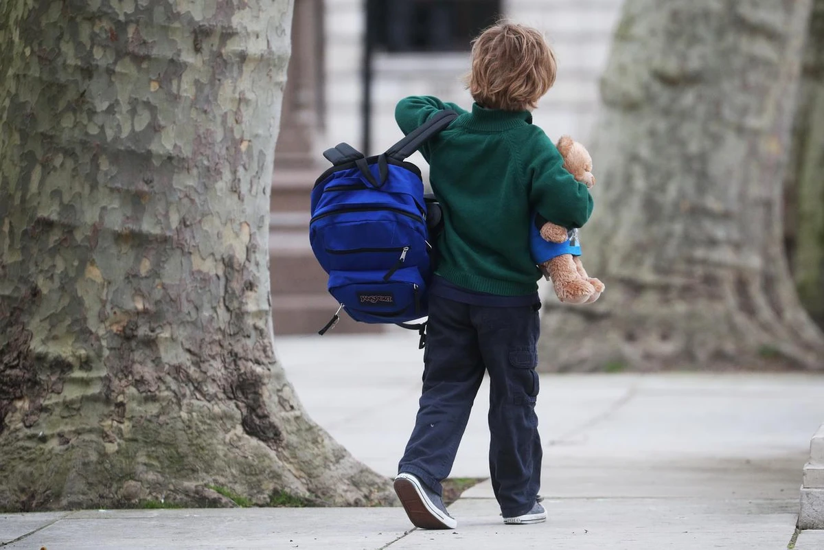 A school child walks in Westminster as the spread of the coronavirus disease (COVID-19) continues, in London, Britain, March 18, 2020. (Reuters)