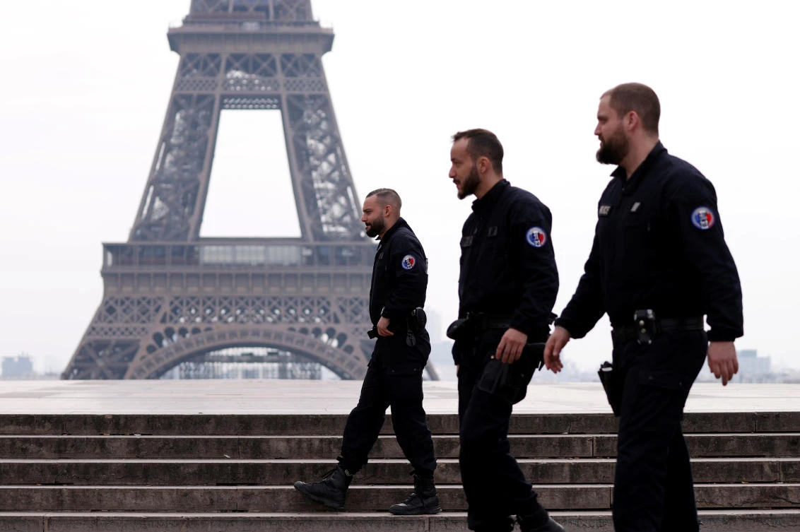 French police patrol at the Tocadero square near the Eiffel tower in Paris amid a lockdown imposed to slow the rate of the coronavirus disease (COVID-19) contagion. (Reuters)