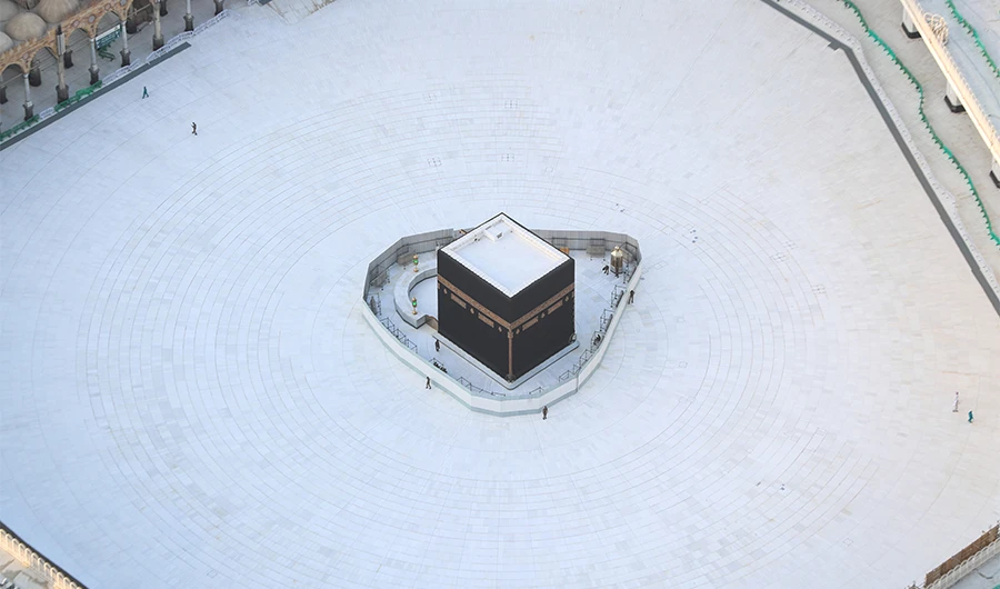 An aerial view shows an empty white-tiled area surrounding the Kaaba in Makkah Grand Mosque, on March 6, 2020. (AFP)