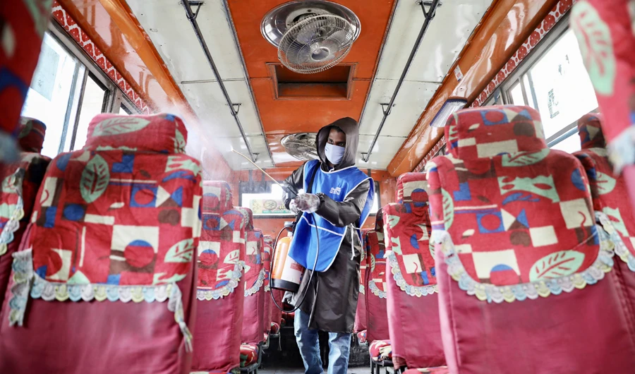 A volunteer sprays disinfectant inside a bus amid concerns about the spread of coronavirus disease (COVID-19) in Dhaka, Bangladesh, March 18, 2020. (REUTERS)