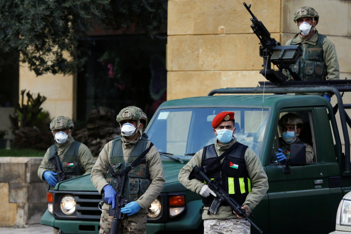 Jordanian army members stand guard outside a hotel that was transformed into a quarantine station as the country takes measures to fight the spread of the coronavirus disease (COVID-19) in Amman, Jordan, March 18, 2020. (File/Reuters)