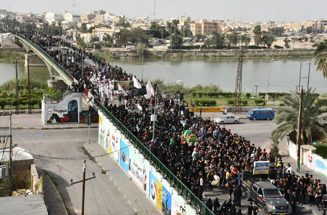 Iraq Shiites defy coronavirus curfews to commemorate revered imam