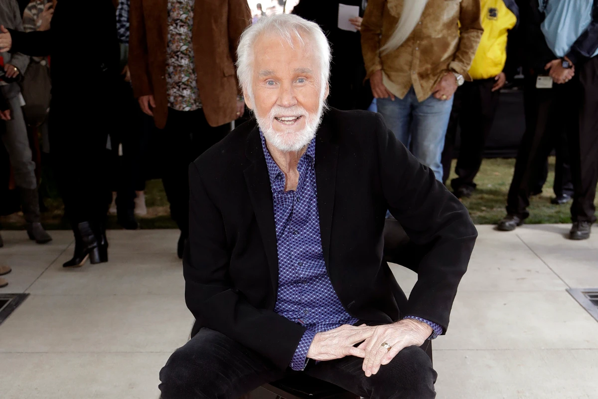 In this Oct. 24, 2017 file photo, Kenny Rogers poses with his star on the Music City Walk of Fame in Nashville, Tennessee. (AP Photo/Mark Humphrey)
