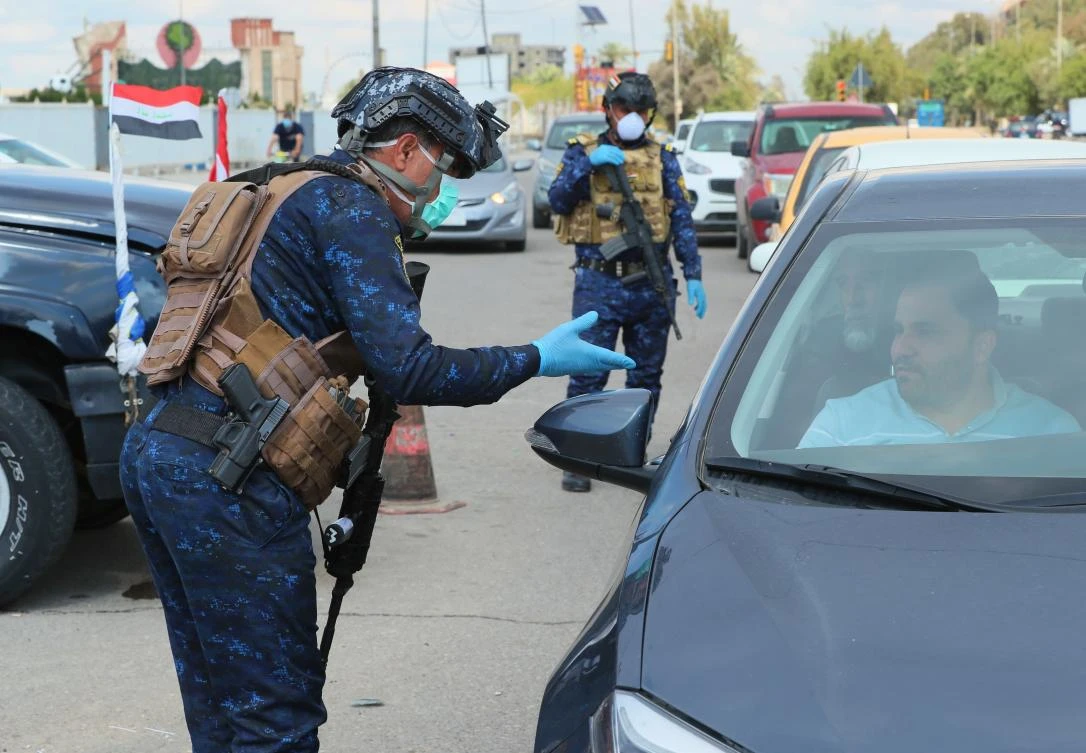 Security forces deployed to imposed curfew in central Baghdad, Iraq, Sunday, March 22, 2020. Iraq announced a weeklong curfew to help fight the spread of the new coronavirus. (AP)