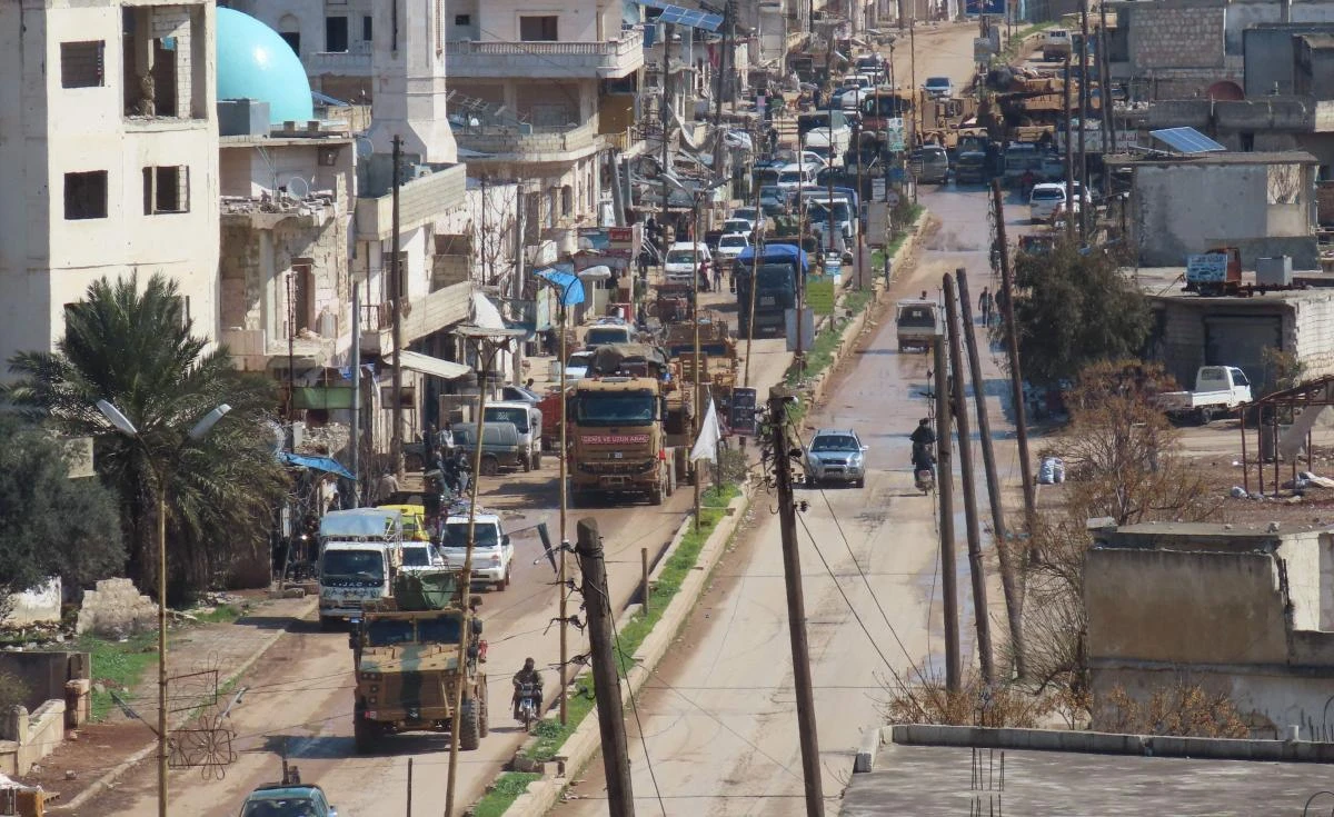 Above, a Turkish military convoy drives through the town of Binnish, in Syria’s northwestern Idlib province near the Turkish border on March 19, 2020. (AFP file photo)
