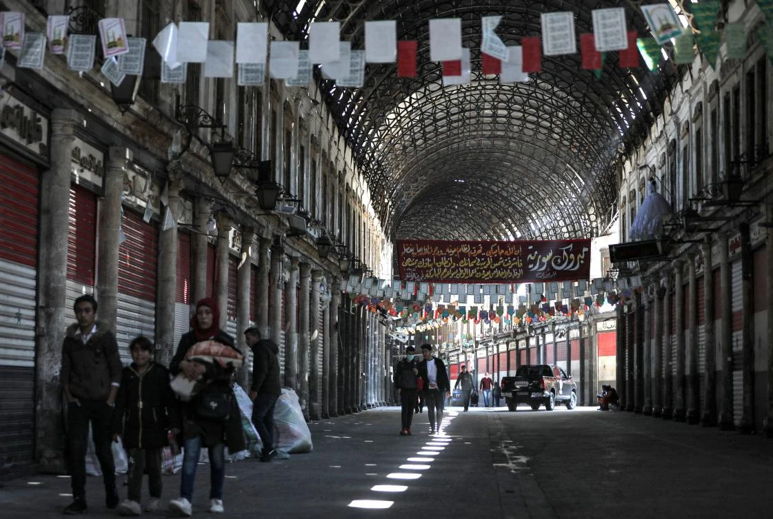 Damascus’ famed Hamidiyeh souk, above, was deserted after the government ordered all shops closed on Sunday. (AFP)