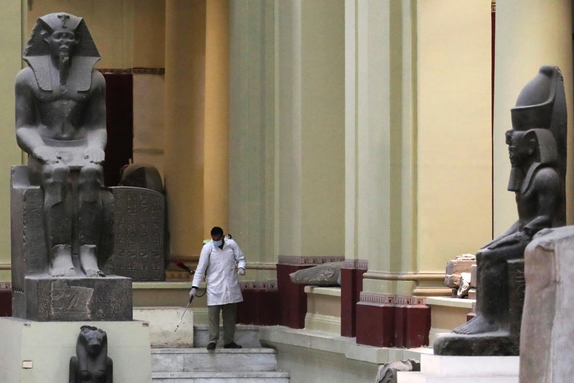 A member of a medical team sprays disinfectant as a precautionary move amid concerns over the coronavirus disease (COVID-19) outbreak, inside the Egyptian Museum in Cairo, Egypt March 23, 2020. (Reuters)